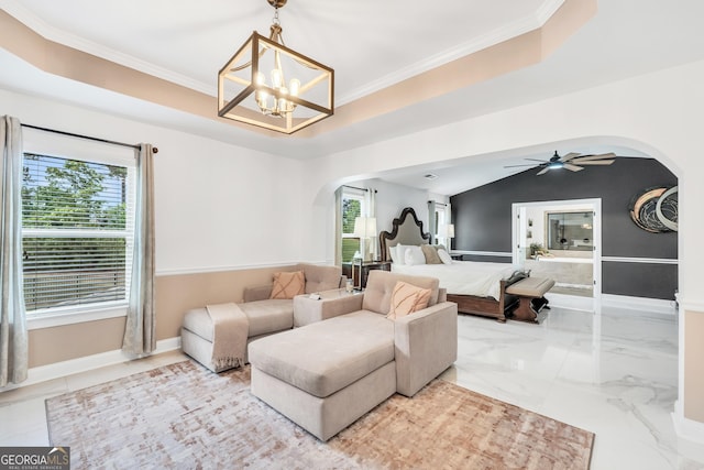 living area featuring arched walkways, baseboards, ornamental molding, and marble finish floor