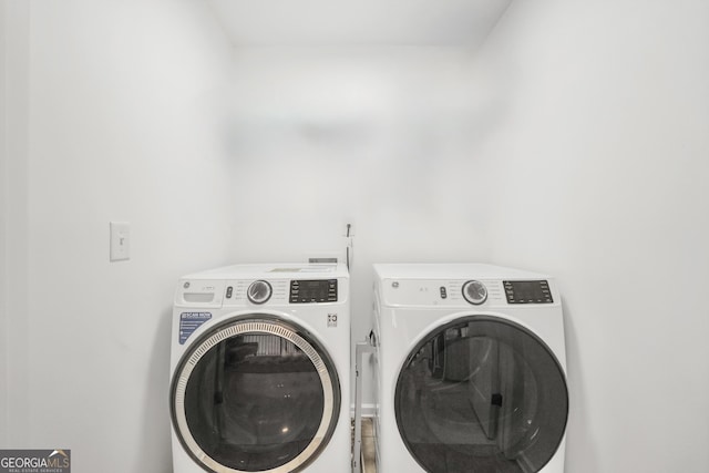 laundry area with laundry area and washer and dryer