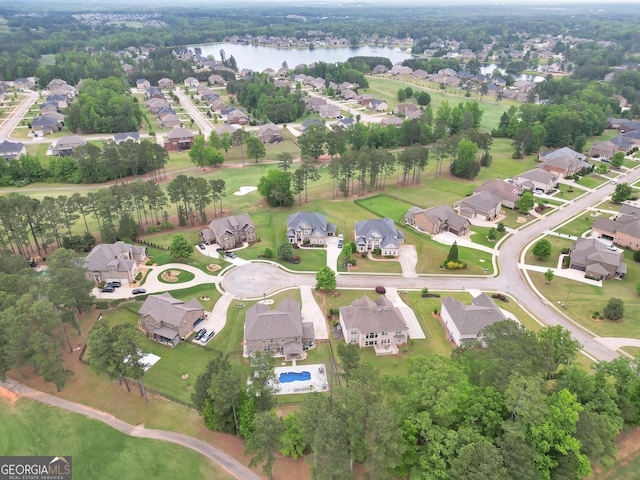 bird's eye view with a water view and a residential view