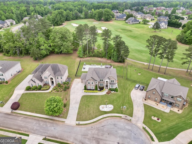 birds eye view of property with a residential view and golf course view