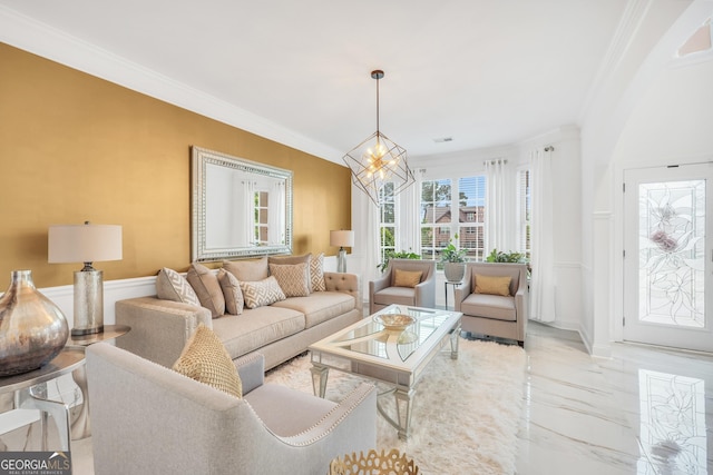 living area featuring ornamental molding, marble finish floor, and a notable chandelier