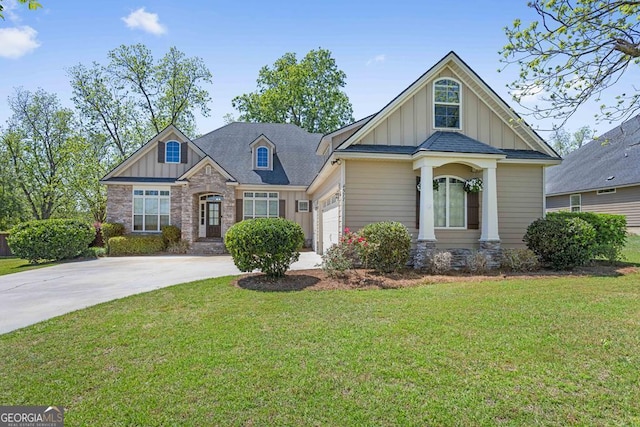 4577 San Saba Dr, Hahira, GA 31632 - craftsman house featuring a garage, a front lawn, board and batten siding, and concrete driveway