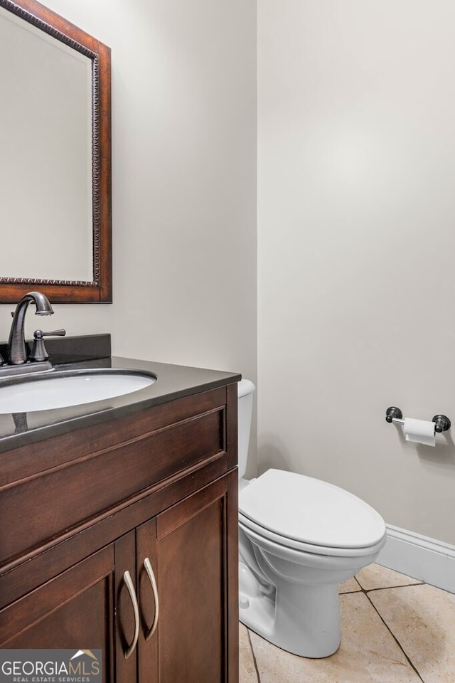 4577 San Saba Dr, Hahira, GA 31632 - bathroom with toilet, baseboards, and vanity