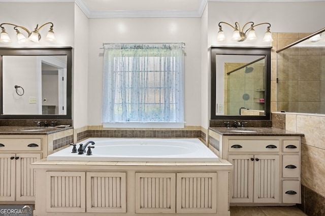 4577 San Saba Dr, Hahira, GA 31632 - bathroom with crown molding, two vanities, a sink, and a bath