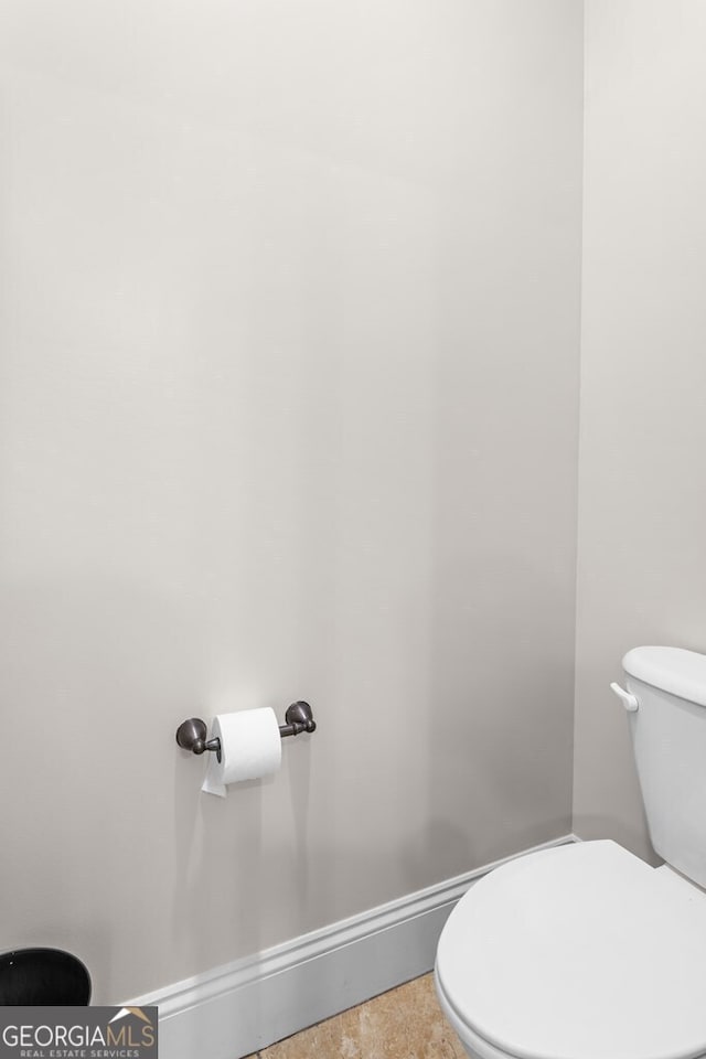 4577 San Saba Dr, Hahira, GA 31632 - bathroom featuring baseboards and toilet