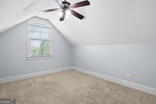 4577 San Saba Dr, Hahira, GA 31632 - additional living space with baseboards, ceiling fan, carpet, and lofted ceiling
