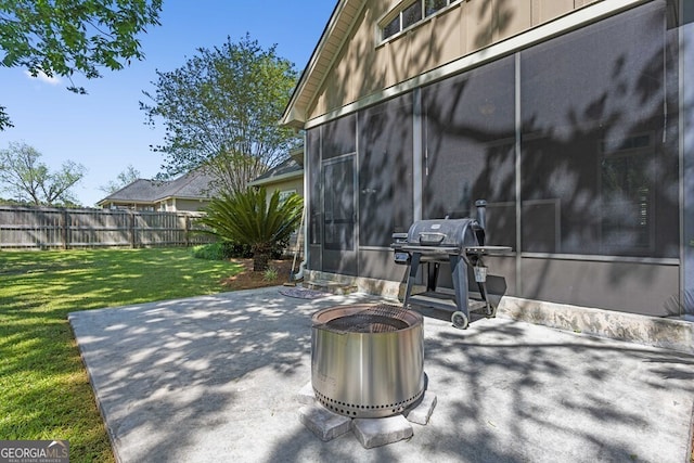 4577 San Saba Dr, Hahira, GA 31632 - view of patio / terrace featuring a sunroom, fence, and a grill