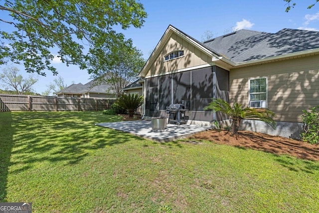 4577 San Saba Dr, Hahira, GA 31632 - back of property featuring fence, a sunroom, a patio, and a yard