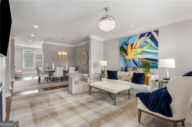 3592 Parkhaven Pl, Brookhaven, GA 30319 - living room with wood finished floors, baseboards, a notable chandelier, ornamental molding, and recessed lighting