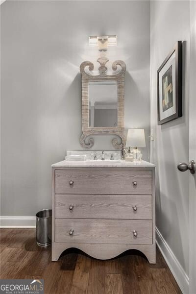3592 Parkhaven Pl, Brookhaven, GA 30319 - bathroom featuring baseboards, vanity, and wood finished floors