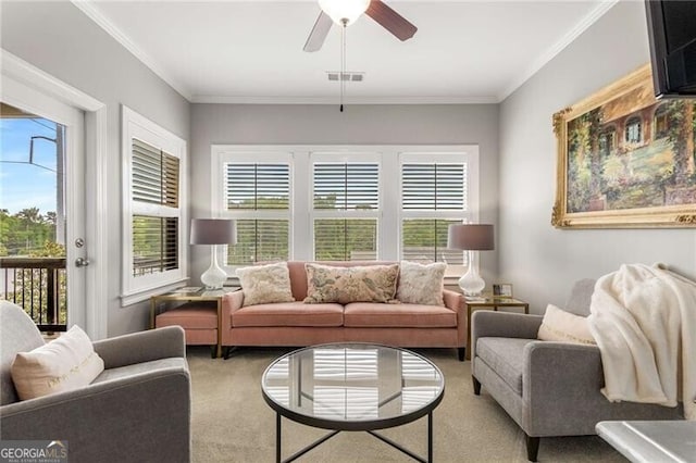 3592 Parkhaven Pl, Brookhaven, GA 30319 - carpeted living area with crown molding, ceiling fan, visible vents, and a wealth of natural light