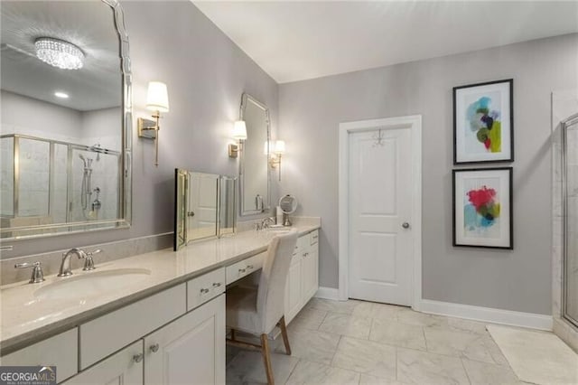 3592 Parkhaven Pl, Brookhaven, GA 30319 - bathroom with double vanity, marble finish floor, baseboards, a shower stall, and a sink