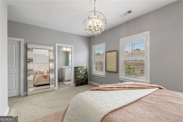 3592 Parkhaven Pl, Brookhaven, GA 30319 - carpeted bedroom with baseboards, a notable chandelier, ensuite bath, and visible vents
