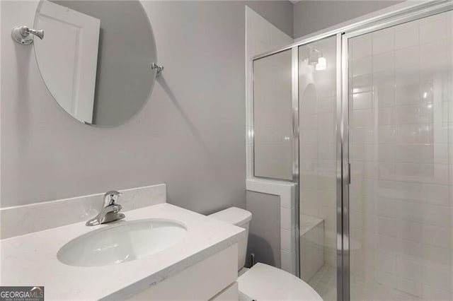 3592 Parkhaven Pl, Brookhaven, GA 30319 - bathroom with vanity, a stall shower, and toilet