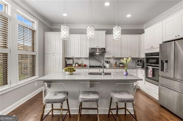 3592 Parkhaven Pl, Brookhaven, GA 30319 - kitchen with a sink, appliances with stainless steel finishes, tasteful backsplash, and under cabinet range hood