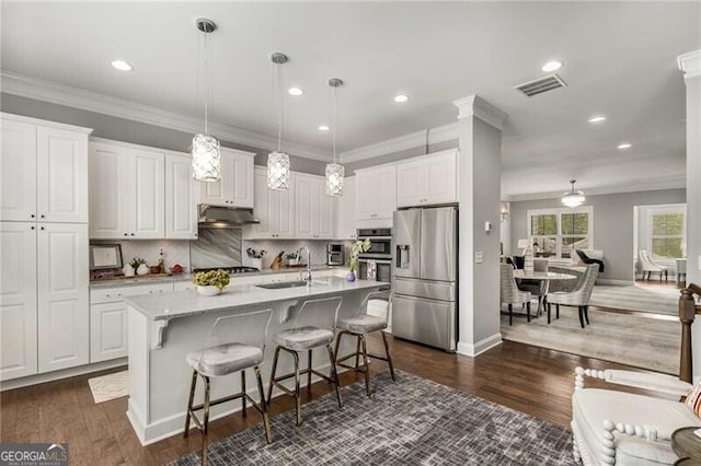3592 Parkhaven Pl, Brookhaven, GA 30319 - kitchen with a sink, white cabinetry, appliances with stainless steel finishes, and under cabinet range hood