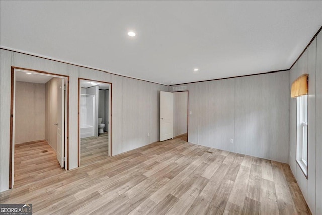 unfurnished bedroom featuring light wood finished floors