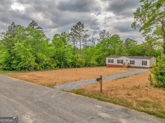 view of yard with a wooded view