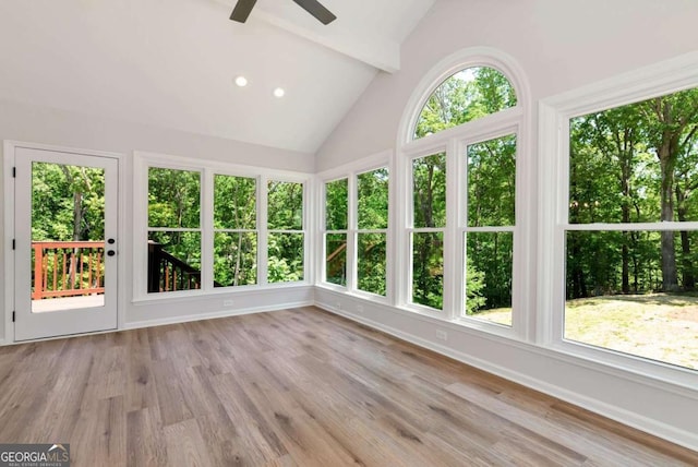 unfurnished sunroom with baseboards, recessed lighting, wood finished floors, and beamed ceiling