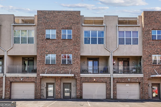 238 Walker St Unit 39, Atlanta, GA 30313 - view of apartment building / complex featuring a garage and driveway