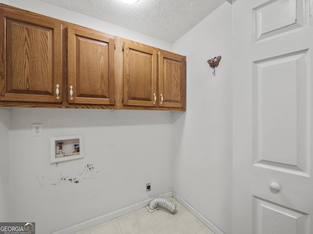 205 Crooked Pine Trl, Baldwin, GA 30511 - washroom with washer hookup, hookup for an electric dryer, a textured ceiling, cabinet space, and baseboards