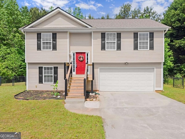 1628 Brook Ln, Monroe, GA 30655 - split foyer home featuring an attached garage and driveway
