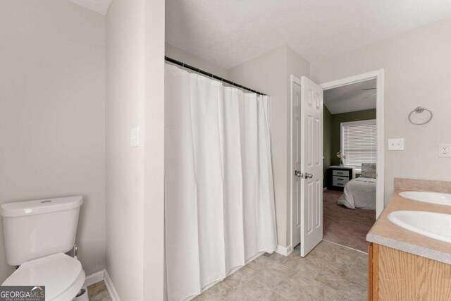 1628 Brook Ln, Monroe, GA 30655 - full bath with double vanity, ensuite bath, and a shower with shower curtain