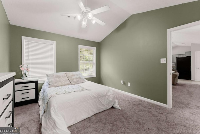 1628 Brook Ln, Monroe, GA 30655 - carpeted bedroom with freestanding refrigerator, vaulted ceiling, and a ceiling fan