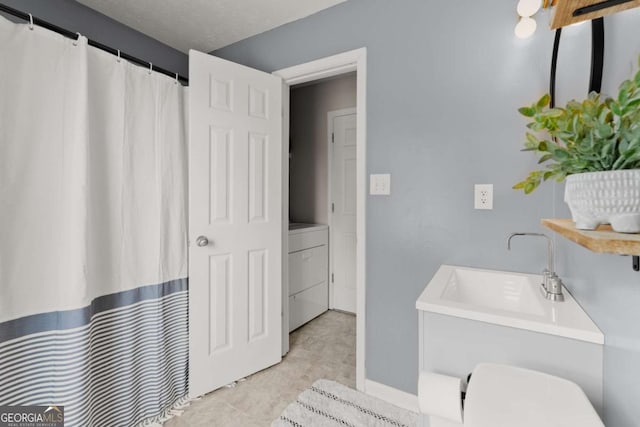 1628 Brook Ln, Monroe, GA 30655 - full bath featuring washer / dryer and a shower with shower curtain