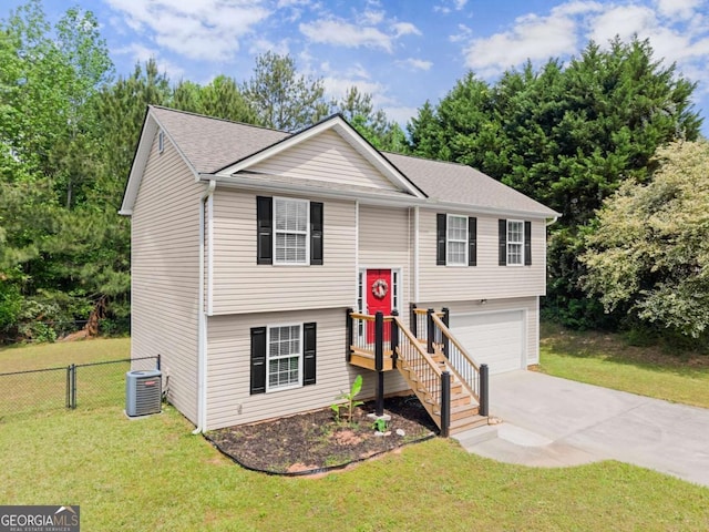 1628 Brook Ln, Monroe, GA 30655 - bi-level home with concrete driveway, an attached garage, and a shingled roof