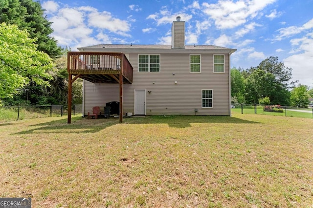 1628 Brook Ln, Monroe, GA 30655 - back of house with a deck, a fenced backyard, and a chimney