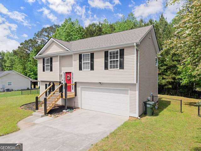 1628 Brook Ln, Monroe, GA 30655 - bi-level home featuring concrete driveway, a garage, and view of scattered trees