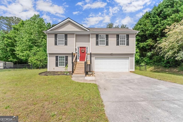 1628 Brook Ln, Monroe, GA 30655 - split foyer home featuring a garage and concrete driveway