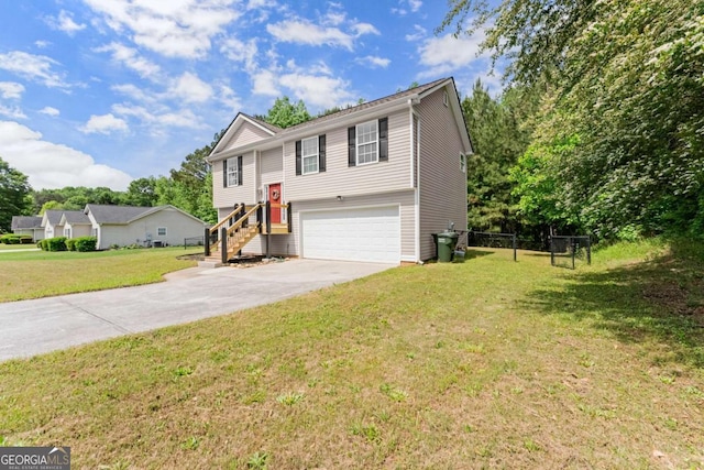 1628 Brook Ln, Monroe, GA 30655 - bi-level home featuring a garage, concrete driveway, and a front lawn