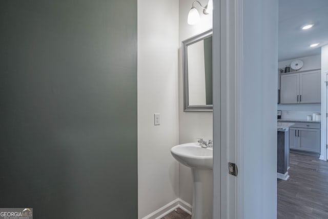 110 Cole St, Pooler, GA 31322 - bathroom featuring a sink, baseboards, recessed lighting, and wood finished floors