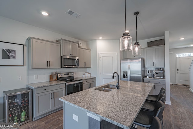 110 Cole St, Pooler, GA 31322 - kitchen featuring gray cabinets, a sink, dark wood-style floors, beverage cooler, and stainless steel appliances