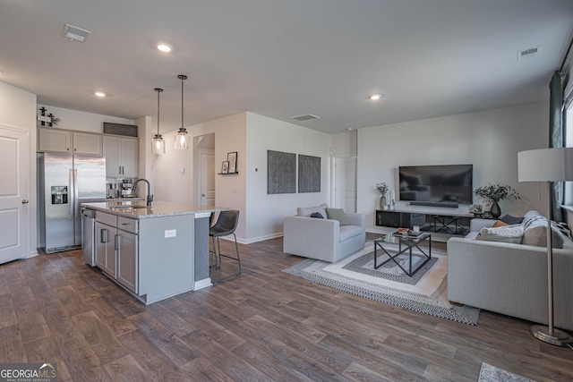 110 Cole St, Pooler, GA 31322 - living room featuring recessed lighting, baseboards, and dark wood finished floors