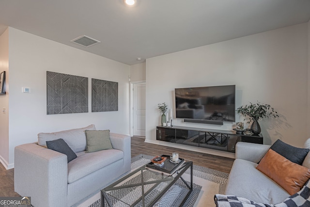 110 Cole St, Pooler, GA 31322 - living area with baseboards, wood finished floors, and visible vents