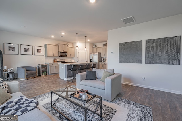 110 Cole St, Pooler, GA 31322 - living room featuring beverage cooler, recessed lighting, baseboards, wood finished floors, and visible vents