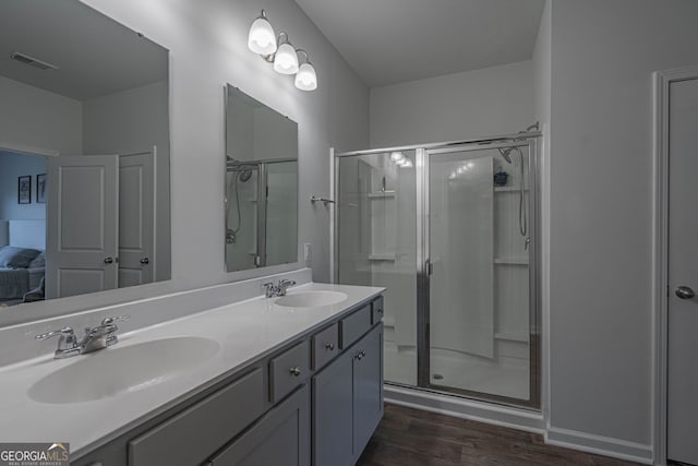 110 Cole St, Pooler, GA 31322 - full bath with double vanity, a sink, wood finished floors, and a shower stall
