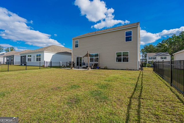 110 Cole St, Pooler, GA 31322 - rear view of house with a lawn, a patio, and a fenced backyard