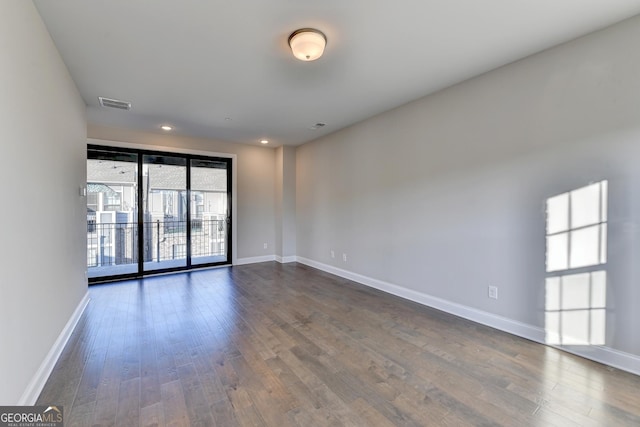 606 Broadview Ter NE, Atlanta, GA 30324 - empty room with baseboards, dark wood-type flooring, recessed lighting, and visible vents