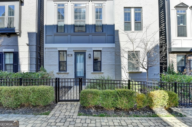 606 Broadview Ter NE, Atlanta, GA 30324 - view of front of home featuring brick siding and a fenced front yard
