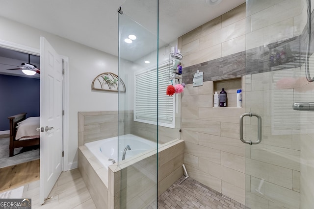 ensuite bathroom featuring a garden tub, tile patterned flooring, baseboards, connected bathroom, and a shower stall