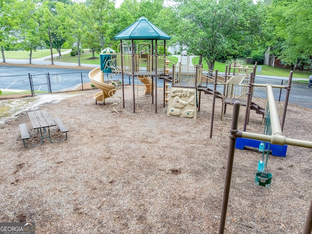 community jungle gym with fence