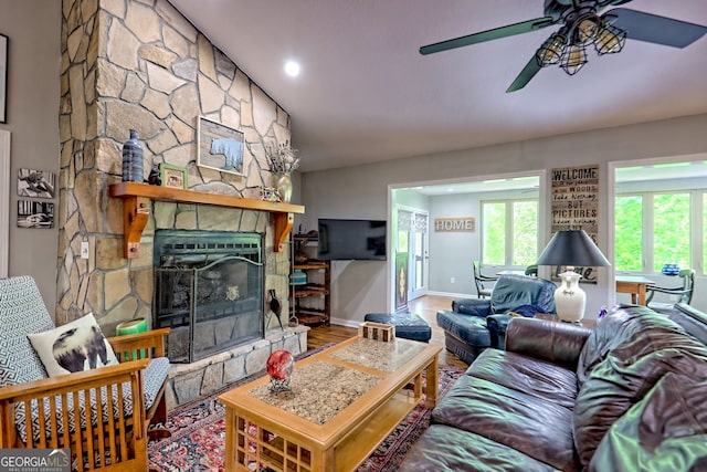 living room with a fireplace, a ceiling fan, baseboards, recessed lighting, and wood finished floors