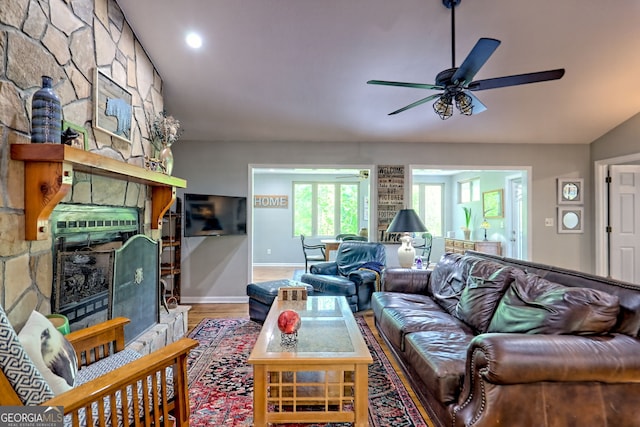 living area featuring a ceiling fan, baseboards, recessed lighting, and wood finished floors