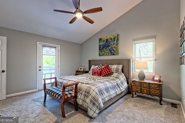 bedroom featuring baseboards, carpet, vaulted ceiling, and access to exterior