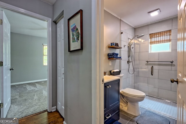 full bath with a healthy amount of sunlight, toilet, and a shower stall