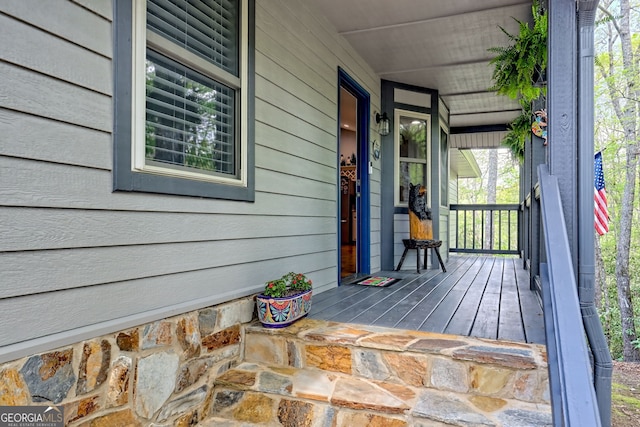 wooden deck featuring covered porch